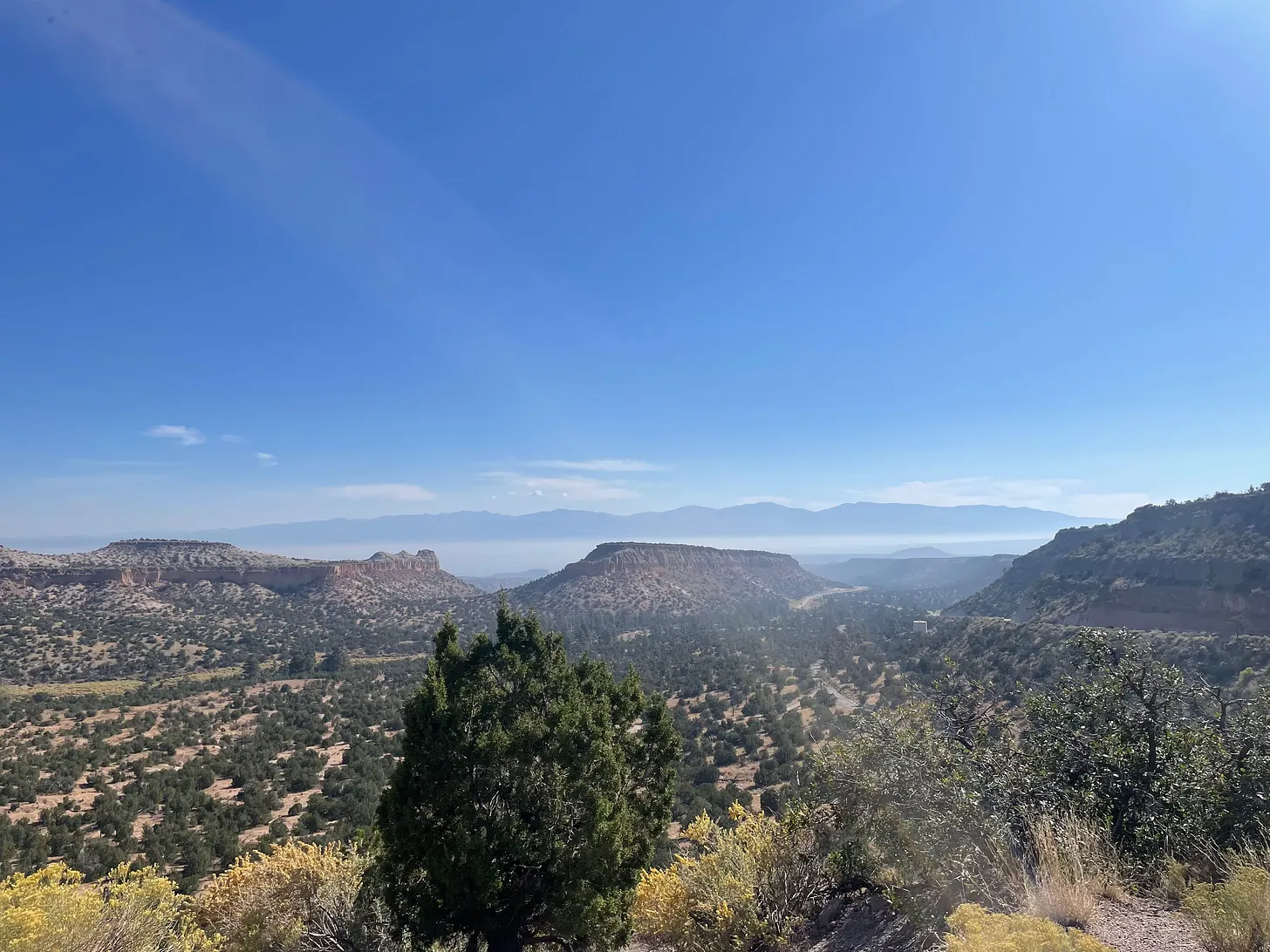 The view from Highway NM-502, looking down from the Pajarito Plateau climbing towards Los Alamos.